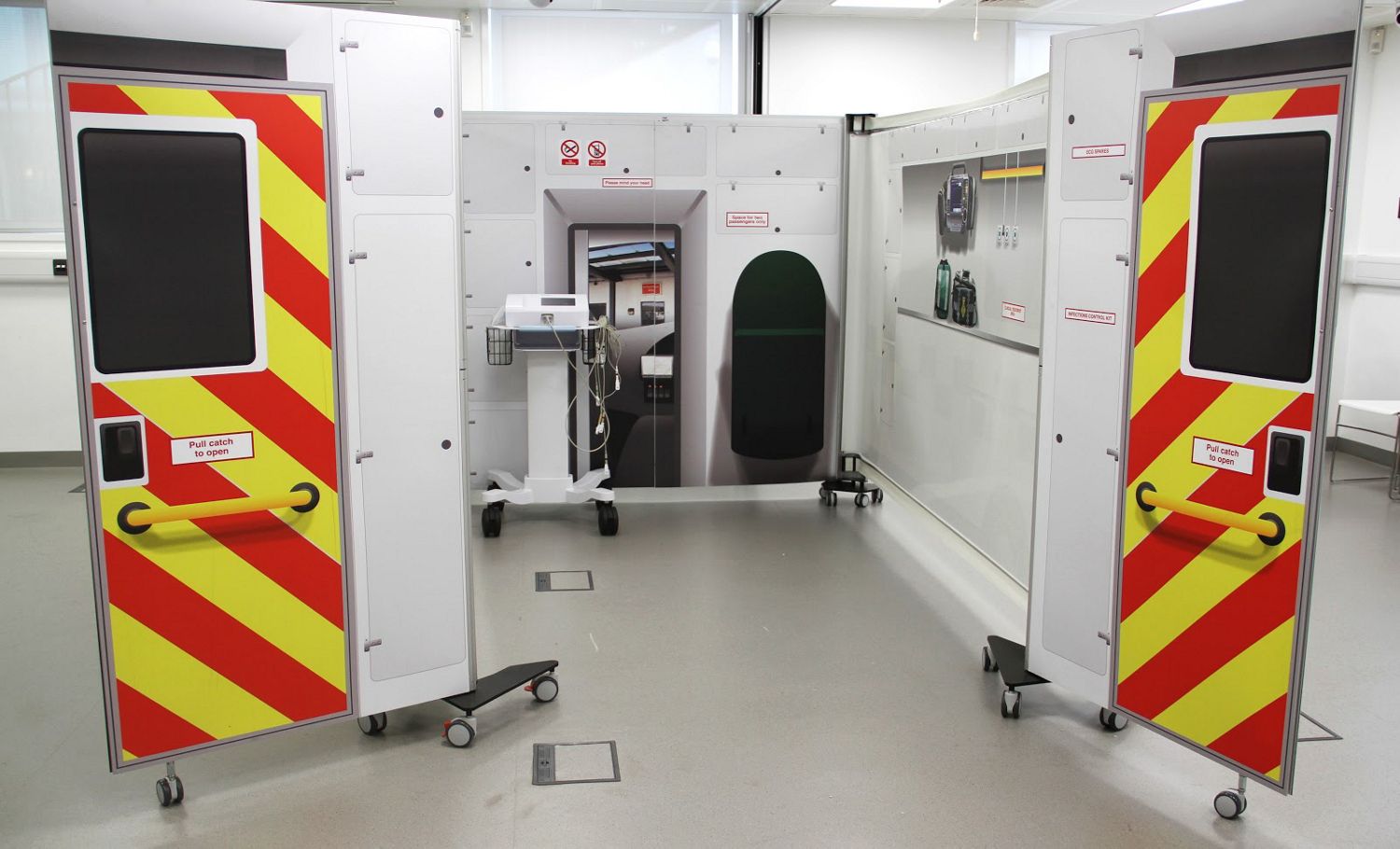 Simulation KwickScreens arranged in the shape of an ambulance